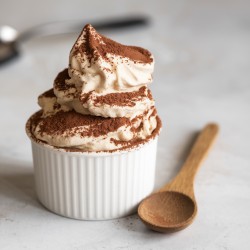 Dark Tiramisu Flavoring Paste Bigatton — dark tiramisu ice cream in cup with cocoa and wooden spoon
