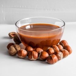 Sirop Noisette Bigatton — présentation en bol avec noisettes