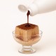 Tiramisù-Topping 22N Bigatton — Topping über Tiramisù-Dessert gegossen