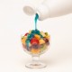 Blaues-Topping 4A Bigatton — Topping über Obstsalat gegossen